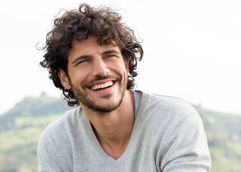 Young man outside without glasses