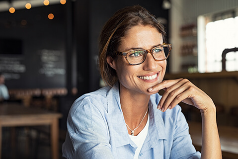 Happy woman wearing glasses